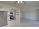 Open-concept living area with modern appliances, white cabinets, and tile floors at 1095 82Nd N Ter # 1095A, St Petersburg, FL 33702