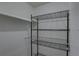 A well-organized walk-in closet with metal shelving for optimal storage space at 1095 82Nd N Ter # 1095A, St Petersburg, FL 33702