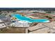 An aerial view of a pristine lagoon, with a beach, dining, and a bright yellow duck at 11014 Rustic Timber Loop, San Antonio, FL 33576