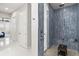 Modern bathroom boasting a stylish shower with a built-in bench and eye-catching blue tile design at 11014 Rustic Timber Loop, San Antonio, FL 33576