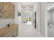 Bright and spacious foyer with high ceilings, elegant lighting, and stylish decor at 11014 Rustic Timber Loop, San Antonio, FL 33576
