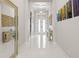 Bright and spacious foyer with high ceilings, elegant lighting, and stylish decor at 11014 Rustic Timber Loop, San Antonio, FL 33576