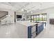 This modern kitchen features stainless steel appliances, a large island, and an open concept design at 11014 Rustic Timber Loop, San Antonio, FL 33576