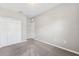 Bedroom featuring a closet, neutral walls, and plush carpeting at 1103 Coral Ln, Dunedin, FL 34698