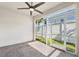 View of backyard from the brick-paved screened in lanai at 1103 Coral Ln, Dunedin, FL 34698