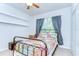 Bright bedroom features a metal frame bed, soft natural light, and closet space at 11231 Spring Point Cir, Riverview, FL 33579