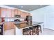 Bright kitchen with stainless appliances, tile backsplash, and central island with seating at 11231 Spring Point Cir, Riverview, FL 33579