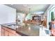Open concept floor plan showing kitchen with granite countertops and view of the living room at 11231 Spring Point Cir, Riverview, FL 33579