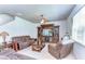 Cozy living room features a ceiling fan, tile floors, and a large window for natural light at 11231 Spring Point Cir, Riverview, FL 33579