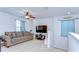 Upstairs living room with neutral decor, ceiling fan, and ample natural light at 11231 Spring Point Cir, Riverview, FL 33579