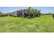 Expansive green backyard with lush grass, perfect for outdoor activities and relaxation at 13121 Pasture View Loop, Riverview, FL 33579