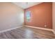 Cozy bedroom with warm walls, modern gray floors, and natural light at 13121 Pasture View Loop, Riverview, FL 33579