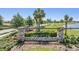Stone monument sign at Hawkstone community entrance with manicured landscaping at 13121 Pasture View Loop, Riverview, FL 33579