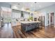 Bright kitchen features an island with bar seating and modern appliances at 13121 Pasture View Loop, Riverview, FL 33579