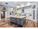 Bright kitchen with island seating, modern pendant lights, and stainless steel appliances at 13121 Pasture View Loop, Riverview, FL 33579