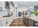 Well-equipped kitchen with a center island, stainless steel appliances, and white cabinetry at 13121 Pasture View Loop, Riverview, FL 33579