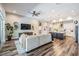 Open-concept living room and kitchen area with modern furnishings at 13121 Pasture View Loop, Riverview, FL 33579