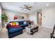 Inviting living room with a comfortable blue sectional and stylish decor at 13121 Pasture View Loop, Riverview, FL 33579