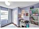 Cozy bedroom with light purple walls, closet space, a desk, and a bookshelf for storage at 13308 Kearney Way, Tampa, FL 33626
