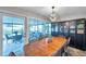 Elegant dining room with modern lighting and a view of the patio at 13308 Kearney Way, Tampa, FL 33626