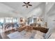 Open-concept living room connected to the dining area with abundant light and space at 13308 Kearney Way, Tampa, FL 33626