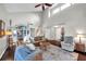 Spacious living room with vaulted ceilings, hardwood floors, and plentiful natural light at 13308 Kearney Way, Tampa, FL 33626