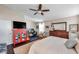 Large main bedroom featuring a work space, sitting area, and a decorative dresser at 13308 Kearney Way, Tampa, FL 33626