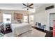 Spacious primary bedroom boasts a king bed, decorative art, and an ensuite bathroom at 13308 Kearney Way, Tampa, FL 33626