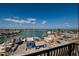 Expansive aerial view overlooking a serene harbor with boats docked near colorful waterfront homes at 13600 Gulf Blvd # 700A, St Petersburg, FL 33708