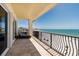 Relaxing balcony with ocean views, lounge seating, and metal railings at 13600 Gulf Blvd # 700A, St Petersburg, FL 33708
