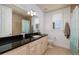 Light and bright bathroom boasts a large vanity with granite counters and walk-in shower at 13600 Gulf Blvd # 700A, St Petersburg, FL 33708