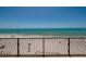 Beautiful beach view from balcony with railings on a clear day at 13600 Gulf Blvd # 700A, St Petersburg, FL 33708
