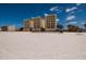 Beautiful beachfront condo building with balconies and stunning ocean views at 13600 Gulf Blvd # 700A, St Petersburg, FL 33708