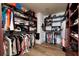 Spacious walk-in closet with custom shelving and ample hanging space for clothes and accessories at 13600 Gulf Blvd # 700A, St Petersburg, FL 33708