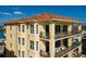 Exterior building detail showing multiple balconies with comfy furniture and gorgeous views at 13600 Gulf Blvd # 700A, St Petersburg, FL 33708