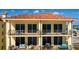 Elegant beachfront condo building with private balconies and stunning ocean views at 13600 Gulf Blvd # 700A, St Petersburg, FL 33708