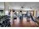 Bright gym featuring modern exercise equipment, mirrored wall, and large windows overlooking outdoor views at 13600 Gulf Blvd # 700A, St Petersburg, FL 33708