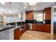 Well-appointed kitchen with sleek stainless-steel appliances, dark countertops, and scenic ocean views at 13600 Gulf Blvd # 700A, St Petersburg, FL 33708