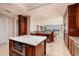Open kitchen design flows into the living and dining area with scenic ocean views at 13600 Gulf Blvd # 700A, St Petersburg, FL 33708