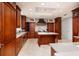 Gourmet kitchen boasts wooden cabinetry, an island, and high-end stainless steel appliances at 13600 Gulf Blvd # 700A, St Petersburg, FL 33708