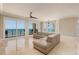 Inviting living room with scenic ocean views and access to a private balcony at 13600 Gulf Blvd # 700A, St Petersburg, FL 33708