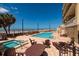 Inviting outdoor pool and hot tub area with beach view at 13600 Gulf Blvd # 700A, St Petersburg, FL 33708