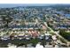 Scenic aerial view showing waterfront property with a private dock in a canal community at 1419 47Th Ne Ave, St Petersburg, FL 33703
