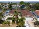 Exterior home elevation of a tile roof home, a two car garage, and a pool at 1419 47Th Ne Ave, St Petersburg, FL 33703