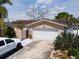 Charming single-story home with a two-car garage, manicured landscaping, and private entrance at 1419 47Th Ne Ave, St Petersburg, FL 33703