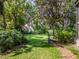 A lush backyard leads to the main house at 1602 Cottagewood Dr, Brandon, FL 33510