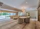 Spacious living room with comfortable seating, a view of the pool, and dining area at 1602 Cottagewood Dr, Brandon, FL 33510