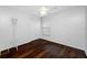 Clean bedroom showcasing hardwood floors, a ceiling fan, and bright natural light at 1610 Navigator Ln, Tarpon Springs, FL 34689