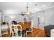 Open dining area adjacent to the living room and kitchen, providing a seamless flow for modern living at 1610 Navigator Ln, Tarpon Springs, FL 34689