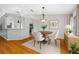 Inviting dining area with wooden table, four chairs, and stylish lighting at 1610 Navigator Ln, Tarpon Springs, FL 34689